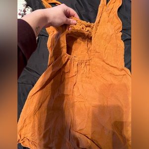 Orange, open back romper